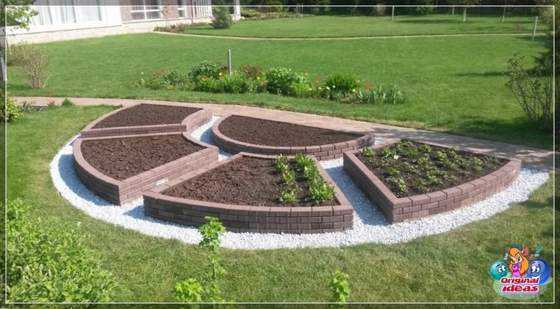 Jardín ornamental de adoquines en forma de sol