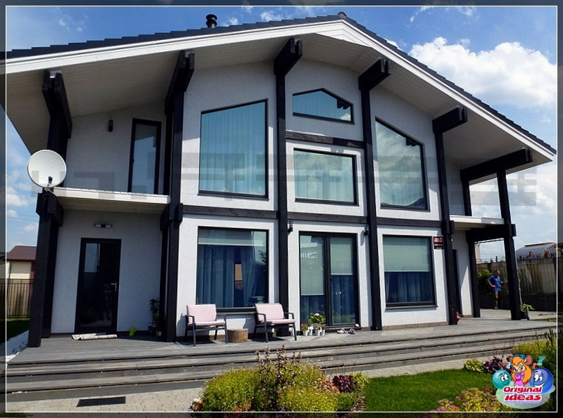 option Sheathing of a frame house with imitation of a bar