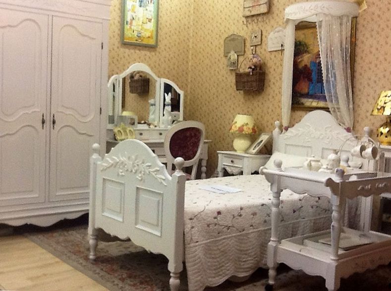 Provence style wooden bed in the nursery