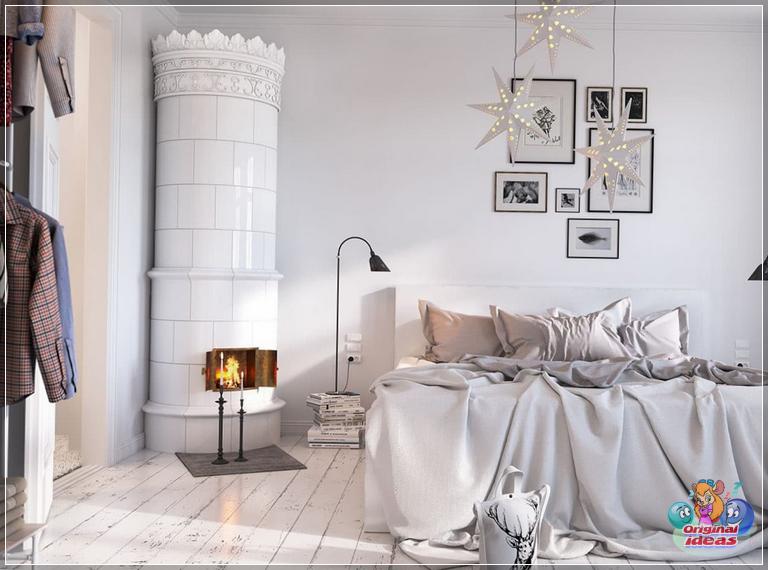 Snow-white bedroom interior with an original fireplace in the form of an ancient tower of a medieval castle